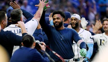 Tampa Bay Rays' Junior Caminero, center, celebrates his walk-off home run during the ninth inning of a baseball game against the Athletics Tuesday, Sept. 15, 2026, in St. Petersburg, Fla. (AP Photo/Jason Behnken)