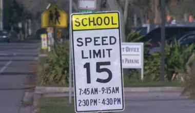 A sign shows the speed limit around Neptne Beach Elementary School, where cameras have been used to monitor drivers.