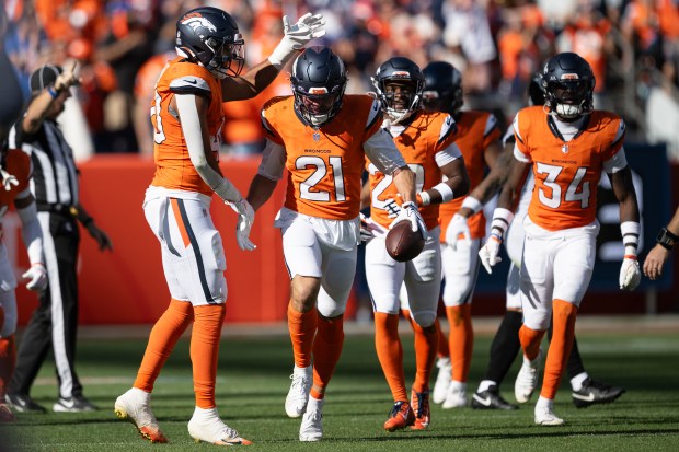 Cornerback Riley Moss (21) of the Denver Broncos celebrates his interception of quarterback Trevor Lawrence (16) of the Jacksonville Jaguars during the second half a 20-13 win on Sunday, Sept. 20, 2026, at Empower Field at Mile High in Denver. (Photo by Timothy Hurst/The Denver Post)