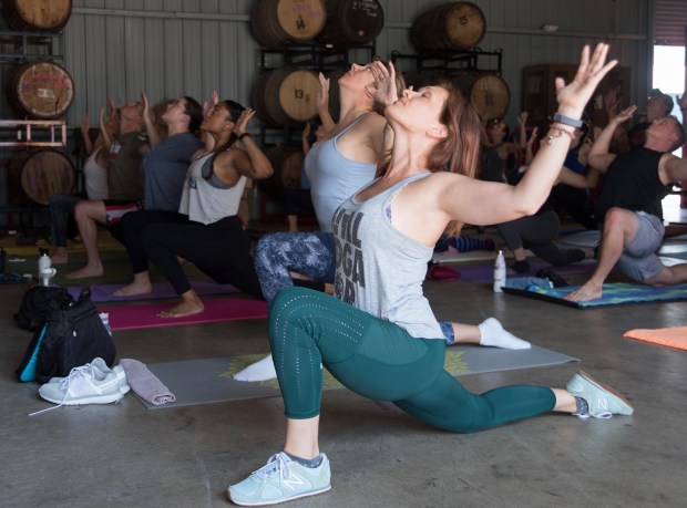 Stretch and then sip at yoga sessions offered by Ales & Asanas at two Broward County craft beer spots. (Gabriel Rodriguez/Courtesy)