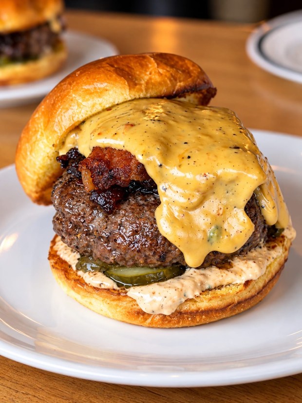 The bacon-onion fondue burger at Grub, a Finer Diner, opening Oct. 1 in Pompano Beach. (George Abbondante / Courtesy)