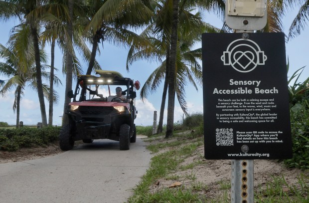 Signs at Pompano Beach designate it as a sensory accessible beach on Friday, Sept. 25, 2026. A new initiative makes six major beaches in Broward County more accessible for people with sensory sensitivities, such as autism, dementia, stroke, and PTSD, by offering sensory bags equipped with noise-canceling headphones, fidget tools, verbal cue cards, and strobe-reduction sunglasses at lifeguard stations. (Mike Stocker/South Florida Sun Sentinel)