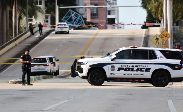 Part of a cranes collapsed on a car on the SE 3rd Ave bridge in Fort Lauderdale on Thursday, April 4, 2024. (Carline Jean/South Florida Sun Sentinel)