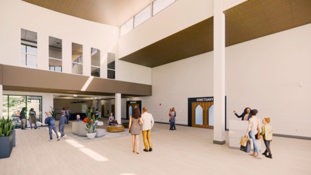 An interior rendering shows the spacious high-ceiling lobby of the new 63,950-square-foot facility at Orangewood Presbyterian Church and Orangewood Christian School. The modern atrium serves as a central hub, connecting administrative areas, classrooms, and entryways to the new sanctuary space. (Schenkel Shultz)