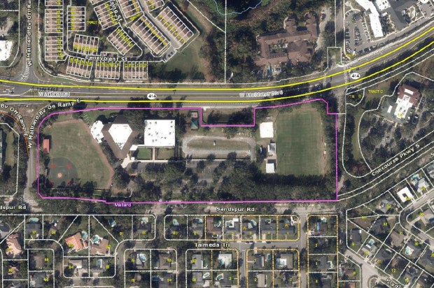 An aerial site map outlines the property boundaries for Orangewood Presbyterian Church and Orangewood Christian School along W. Maitland Blvd. in Maitland, Florida. The $35 million campus plan features a new two-story, 63,950-square-foot structure built on an open area of the site, alongside reconfigured parking and temporary modular classrooms to support the expansion. (City of Maitland)