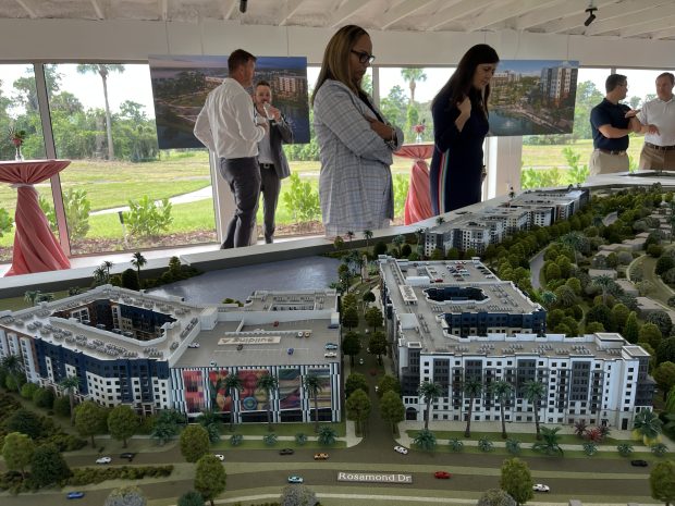 Orlando City Commissioner Shan Rose studies a scale model of Phase 1, which will be underway before the end of the year. (Staff photo)