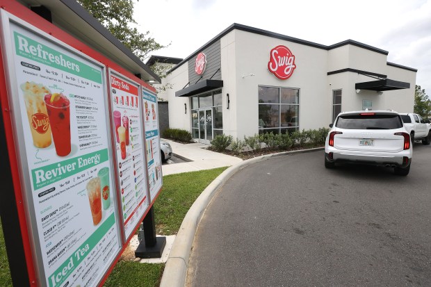 The drive-through line is pictured at SWIG soda shop in Clermont on Monday, June 30, 2025. (Stephen M. Dowell/Orlando Sentinel)