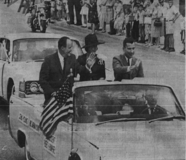 Orlando's John Young, right, waves to the crowd during a parade along Orange Avenue during John Young Day on April 24, 1965 in honor of the hometown astronaut's first spaceflight with Gus Grissom earlier that year on Gemini III. Riding with Young was wife Barbara and U.S. Vice President Hubert H. Humphrey. (Orlando Evening Star file/Frank Russell)
