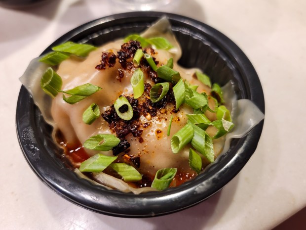 Evil Dead: Burn inspired lots of spicy eats. The Lasagna Burn pot stickers were among my favorite festival bites. The layered Szechuan-style pork dumplings come topped with chili crisp. It's ample, delicious and fantastic for chasing cocktails as you roam the park. (Photo courtesy Lisa Wilk/TasteCookSip.com)
