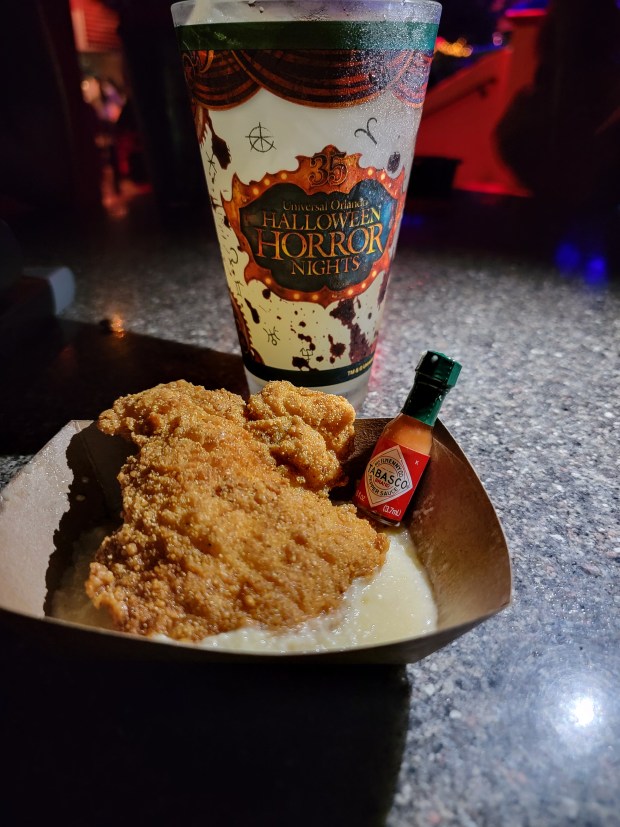 Annie's Juke Joint Catfish & Grits, another solid plate from the Sinners booth. It's paired with the Slide-Guitar Smash, which features corn whiskey as its foundation. (Photo courtesy Lisa Wilk/TasteCookSip.com)