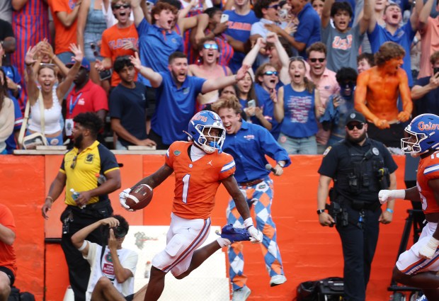 Florida receiver Vernell Brown III (1) returns a punt for a touchdown during the Gators' 52-3 win against Campbell University Sept. 12 at Ben Hill Griffin Stadium in Gainesville. (Stephen M. Dowell/Orlando Sentinel)