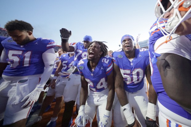 Florida Gators players celebrate beating Ole Miss 52-28 Saturday at Ben Hill Griffin Stadium in Gainesville. (Photo by Dustin Markland/Getty Images)
