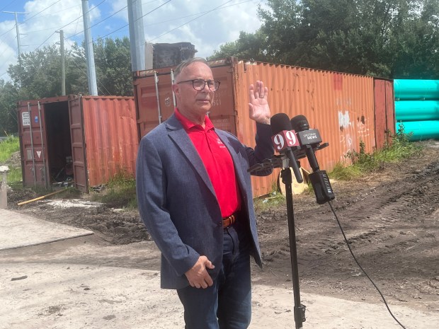 Orange County mayoral candidate Chris Messina holds a news conference on Thursday, September 17, 2026, at the site of a major sewage spill near Aquatica in Orange County. About 342,000 gallons were spilled on two separate days. (Silas Morgan/Orlando Sentinel)