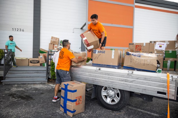 Volunteers help to unload and sort donations to send to Colombia at the Mecatos Bakery warehouse in Orlando on Aug. 28, 2026. Colombians in Central Florida are rallying to send supplies and humanitarian relief to the hardest hit areas of Colombia following a 7.4-magnitude earthquake that struck on Aug. 10. (Patrick Connolly/Orlando Sentinel)