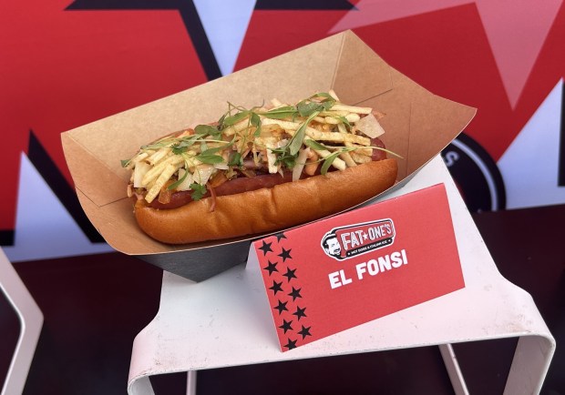 Fat One's El Fonsi -- a shout-out to singer Luis Fonsi -- has ham, turkey, sofrito, potato sticks, onion jam and more. (Dewayne Bevil/Orlando Sentinel)