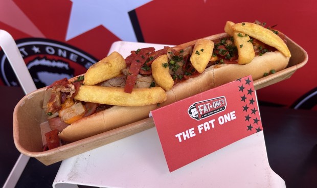 The Fat One from Fat One's is a footlog dog with roasted pork, pepperoni, chili beans, fries and more. (Dewayne Bevil/Orlando Sentinel)(Dewayne Bevil/Orlando Sentinel)