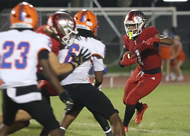 Edgewater senior running back Jaelyn Powell looks for running room against West Orange on Friday night. Powell ran for 148 yards and 2 touchdowns as the Eagles upset the previously unbeaten Warriors 31-6, Sept 25, 2026. (Chris Hays/Orlando Sentinel)