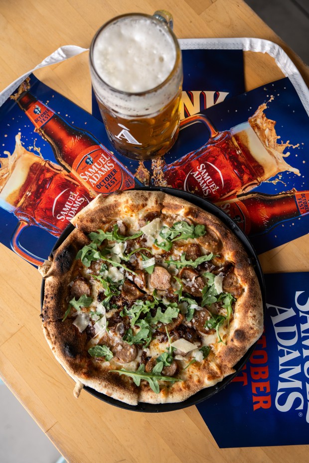Nona Street Pizza at À La Cart SoDo will have a bratwurst pie on the menu for Oktoberfest. Samuel Adams will be sponsoring the stein-holding competition in both locations. (Photo courtesy Christina Petsos/À La Cart)