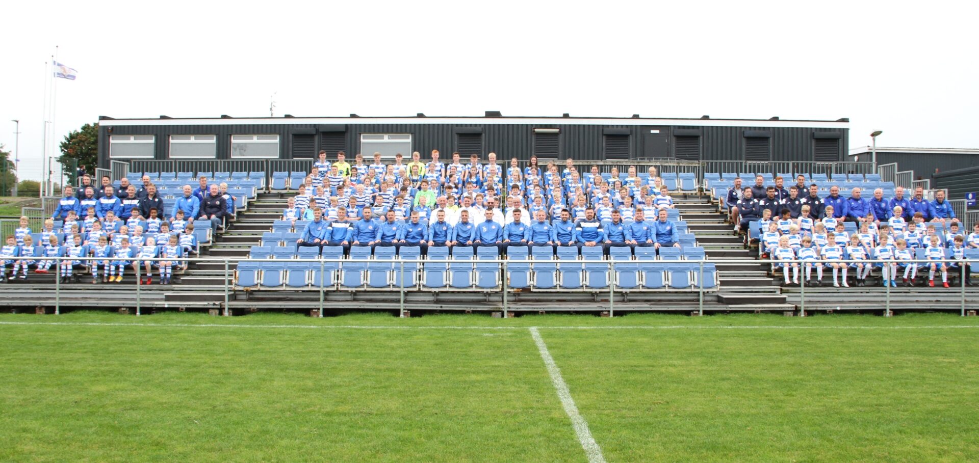 Kilwinning Rangers FC players, youth teams and staff gathered in the stands at the club's stadium in Scotland