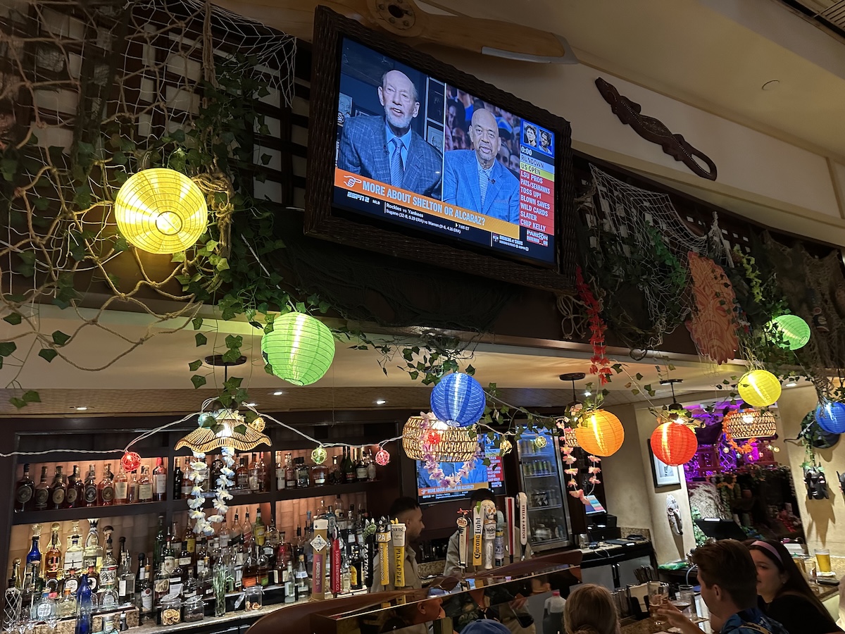 Bar decorations consisting of paper lanterns,  fishing nets, flower garlands and more