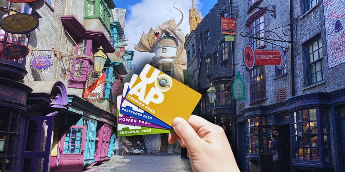 A person holding the Universal Orlando Resort annual passes inside of Diagon Alley at Universal Studios Florida.
