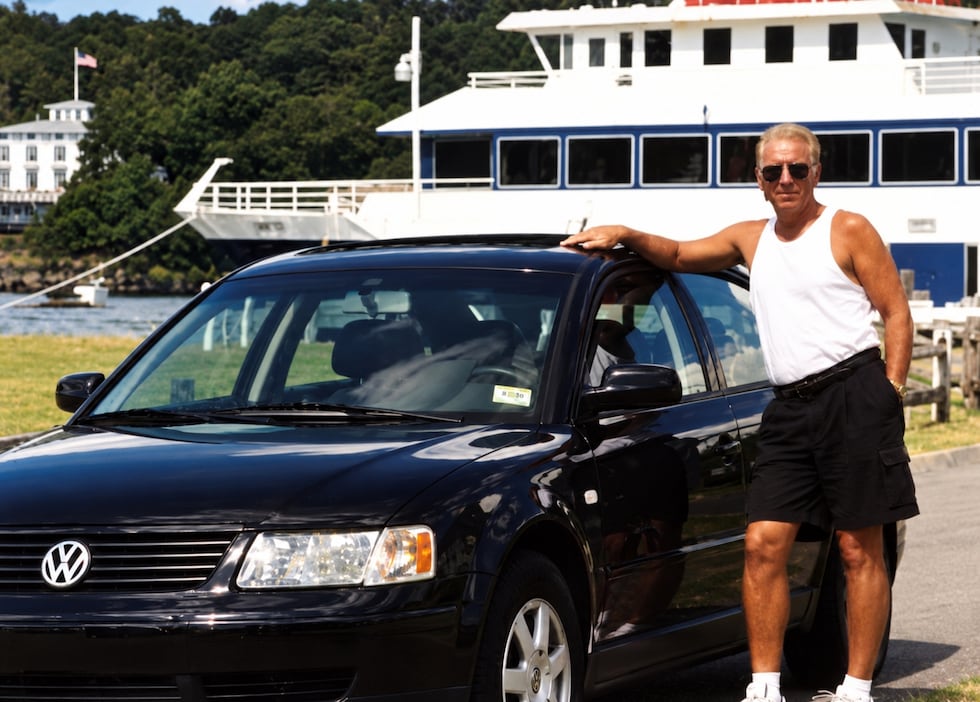 Richard Gabrielle stands next to his VW.