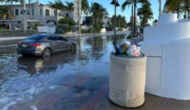 Sea level rise signs as king tides swamp coastal roads