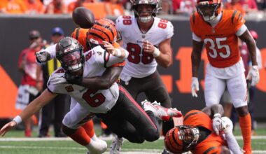 Cincinnati Bengals linebacker Barrett Carter (49) forces a fumble of Tampa Bay Buccaneers quarterback Baker Mayfield (6) during an NFL football game in Cincinnati, Sunday, Sept. 13, 2026. (AP Photo/Kareem Elgazzar)