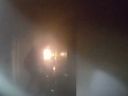 A Seattle police officer is seen in a video evacuating residents in an apartment building.