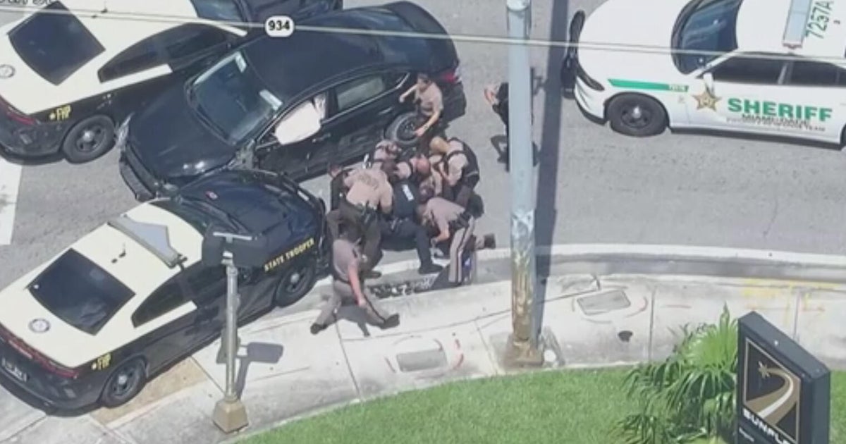 Possible carjacking suspect taken into custody after pursuit through streets of northwest Miami-Dade