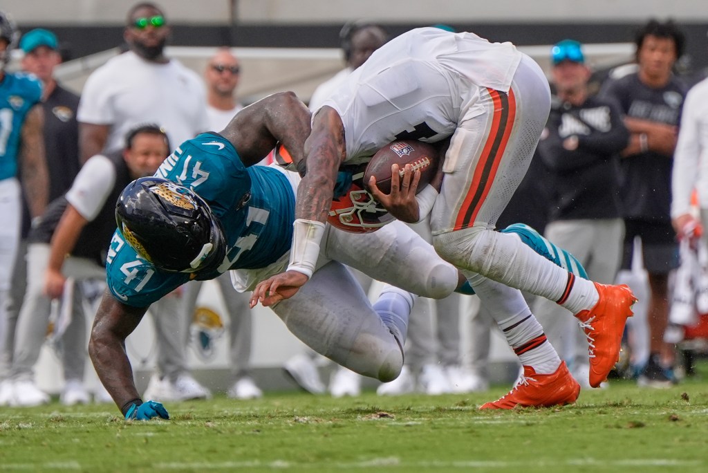 Jacksonville Jaguars defensive end Josh Hines-Allen (41) sacks Cleveland Browns quarterback Deshaun Watson.