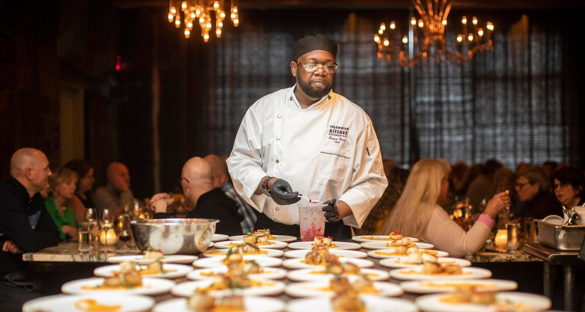 A chef setting up food