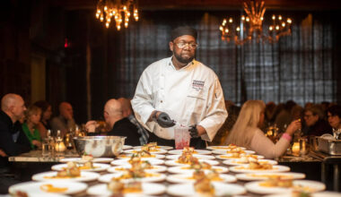 A chef setting up food