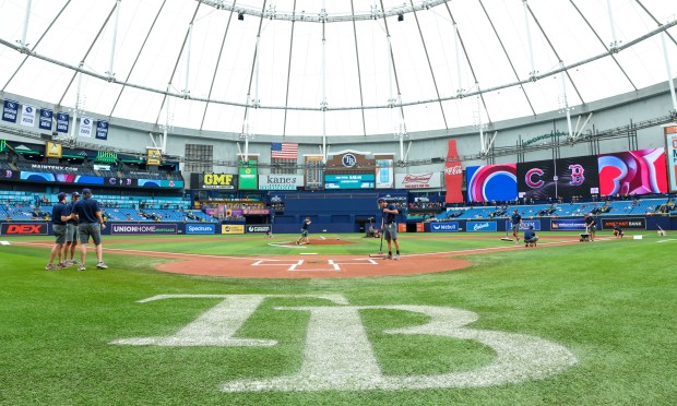 Crews prepare the field for a baseball game between the Chicago Cubs and the Boston Red Sox at Tropicana Field, Sunday, Sept. 27, 2026, in St. Petersburg, Fla. (AP Photo/Chris Urso)
