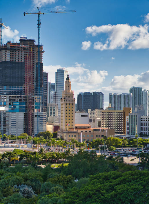 High-rises under construction near Freedom Tower, Miami's first skyscraper when it was completed in 1925. The city is now beginning to go supertall. Image courtesy Nicholas Fuentes/Unsplash.
