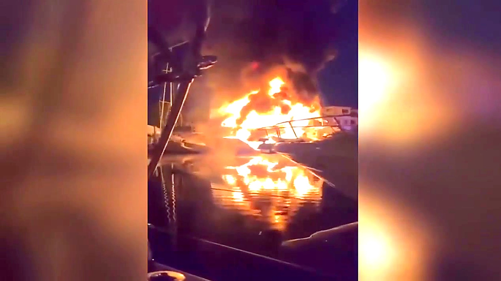 A bystander's video from a neighboring boat shows the fire lighting up the Las Olas waterway.