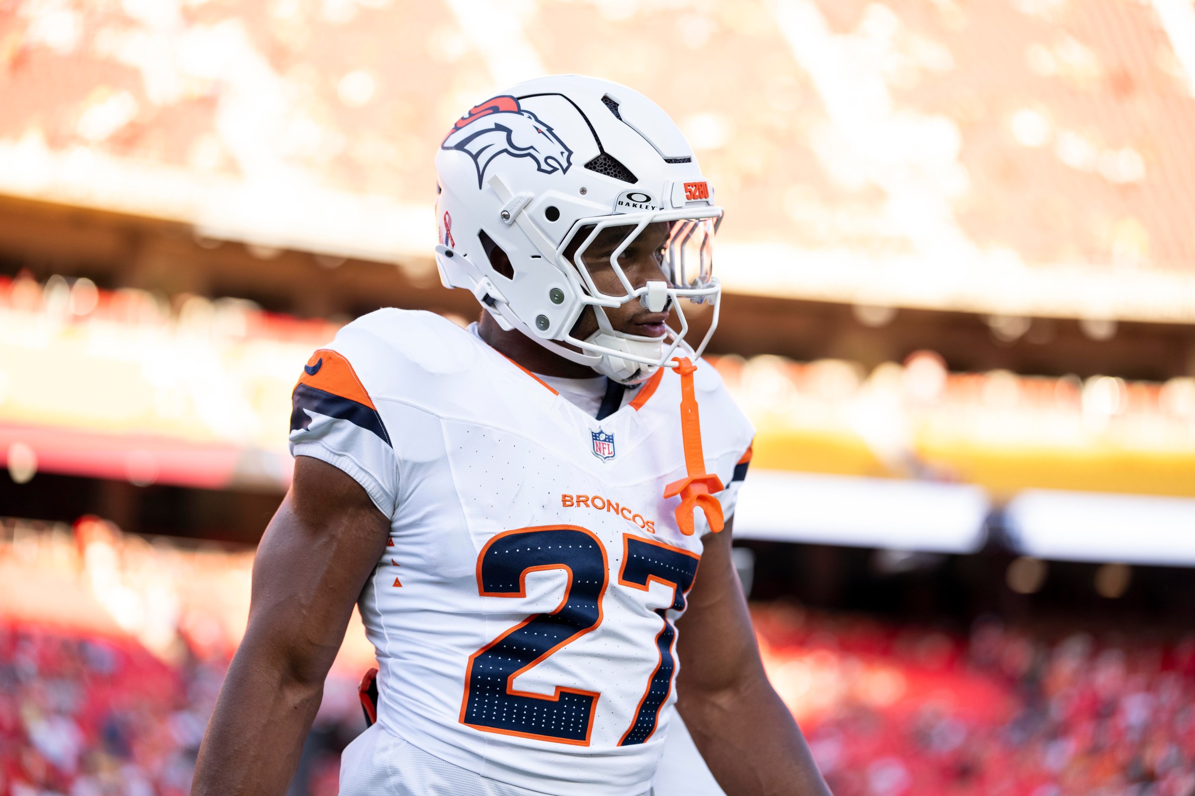 KANSAS CITY, MISSOURI - SEPTEMBER 14: J.K. Dobbins #27 of the Denver Broncos looks on against the Kansas City Chiefs prior to an NFL football game at Arrowhead Stadium on September 14, 2026 in Kansas City, Missouri. (Photo by Michael Owens/Getty Images)