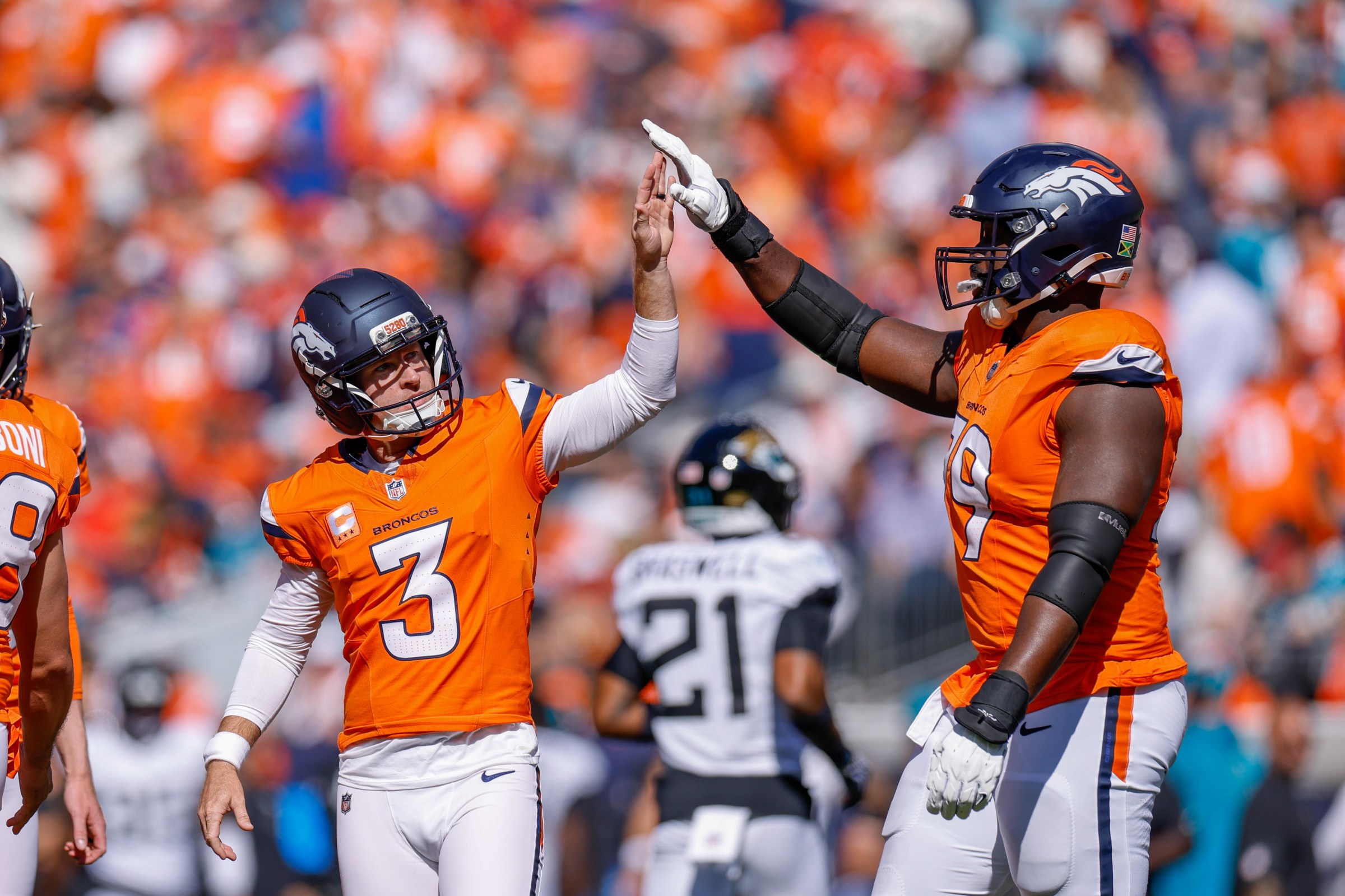 DENVER, COLORADO - SEPTEMBER 20: Wil Lutz #3 and Matt Peart #79 of the Denver Broncos celebrate during the second quarter of a game against the Jacksonville Jaguars at Empower Field At Mile High on September 20, 2026 in Denver, Colorado. (Photo by Lauren Leigh Bacho/Getty Images)