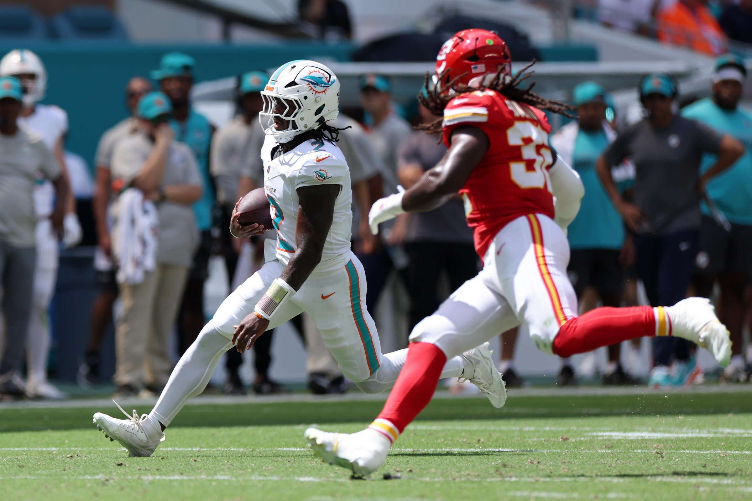 MIAMI GARDENS, FLORIDA - SEPTEMBER 27: Malik Willis #2 of the Miami Dolphins is pursued by Nick Bolton #32 of the Kansas City Chiefs during the first quarter at Hard Rock Stadium on September 27, 2026 in Miami Gardens, Florida. (Photo by Carmen Mandato/Getty Images)