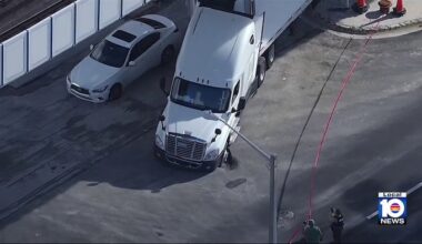 Sinkhole leaves tractor-trailer, sedan stuck in northwest Miami-Dade roadway