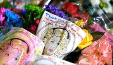 Visitors don dresses for Dolly Parton Day at Jacksonville Flower Market on Friday