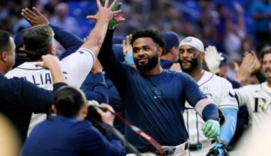 Tampa Bay Rays' Junior Caminero, center, celebrates his walk-off home run during the ninth inning of a baseball game against the Athletics Tuesday, Sept. 15, 2026, in St. Petersburg, Fla. (AP Photo/Jason Behnken)