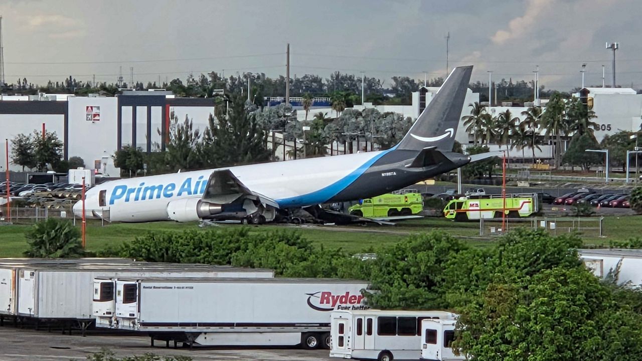 An Amazon cargo plane sits at the Miami International Airport after it overshot the runway Sunday, Sept. 6, 2026. (AP Photo/David Fischer)