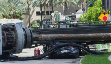 A large construction crane collapsed and crushed a car on Monday, Sept. 14, 2026, in Miami. (AP Photo/Marta Lavandier)