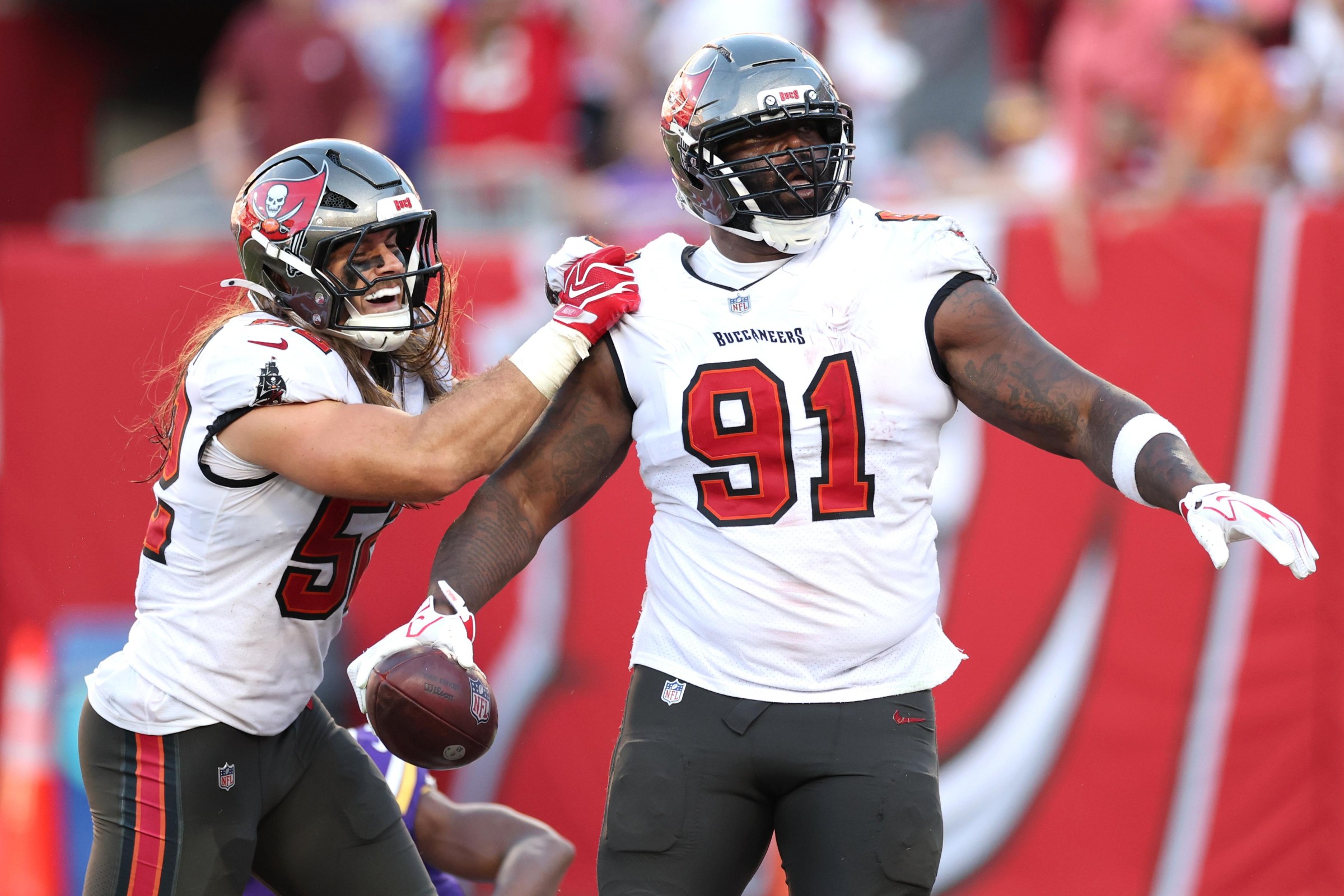 Sep 27, 2026; Tampa, Florida, USA; Tampa Bay Buccaneers linebacker Christian Rozeboom (52) and defensive tackle A’Shawn Robinson (91) react after a play against the Minnesota Vikings during the third quarter at Raymond James Stadium. Mandatory Credit: Matt Pendleton-Imagn Images