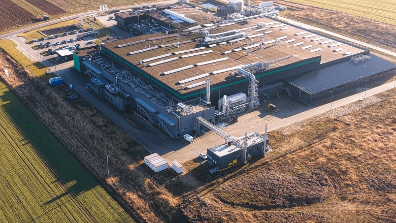 Aerial drone view of a modern high-tech data center facility and cloud computing infrastructure campus.