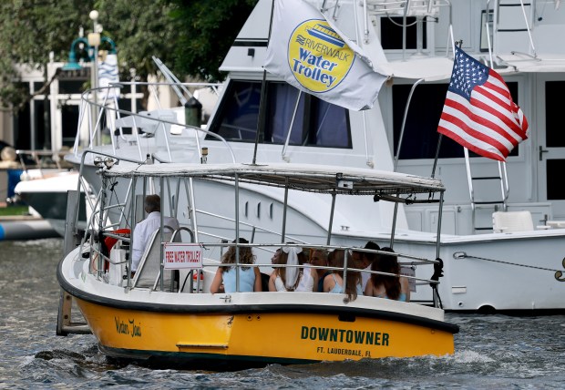 Fort Lauderdale's free water trolley makes its way down the New River on Sept. 12. Ridership has doubled in the past five years, city officials say. (Mike Stocker/South Florida Sun Sentinel)