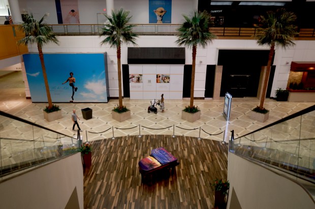 A shopper strolls through the Galleria mall in Fort Lauderdale on Friday. (Mike Stocker/South Florida Sun Sentinel)