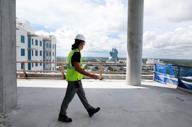Corey Evrard, senior project manager for El-Ad National Properties, gives a tour Tuesday of the first tower that's part of the Plaza Davie District megaproject on the rise in Davie. (Carline Jean/South Florida Sun Sentinel)