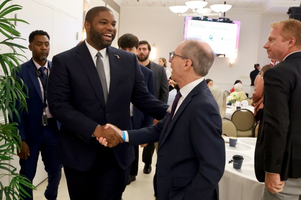 Republican gubernatorial nominee Byron Donalds greets Shane Strum, president and CEO of both Broward Health and Memorial Healthcare System, during the Sunshine Economy Summit in Fort Lauderdale on Wednesday, Sept. 23, 2026. (Mike Stocker/South Florida Sun Sentinel)